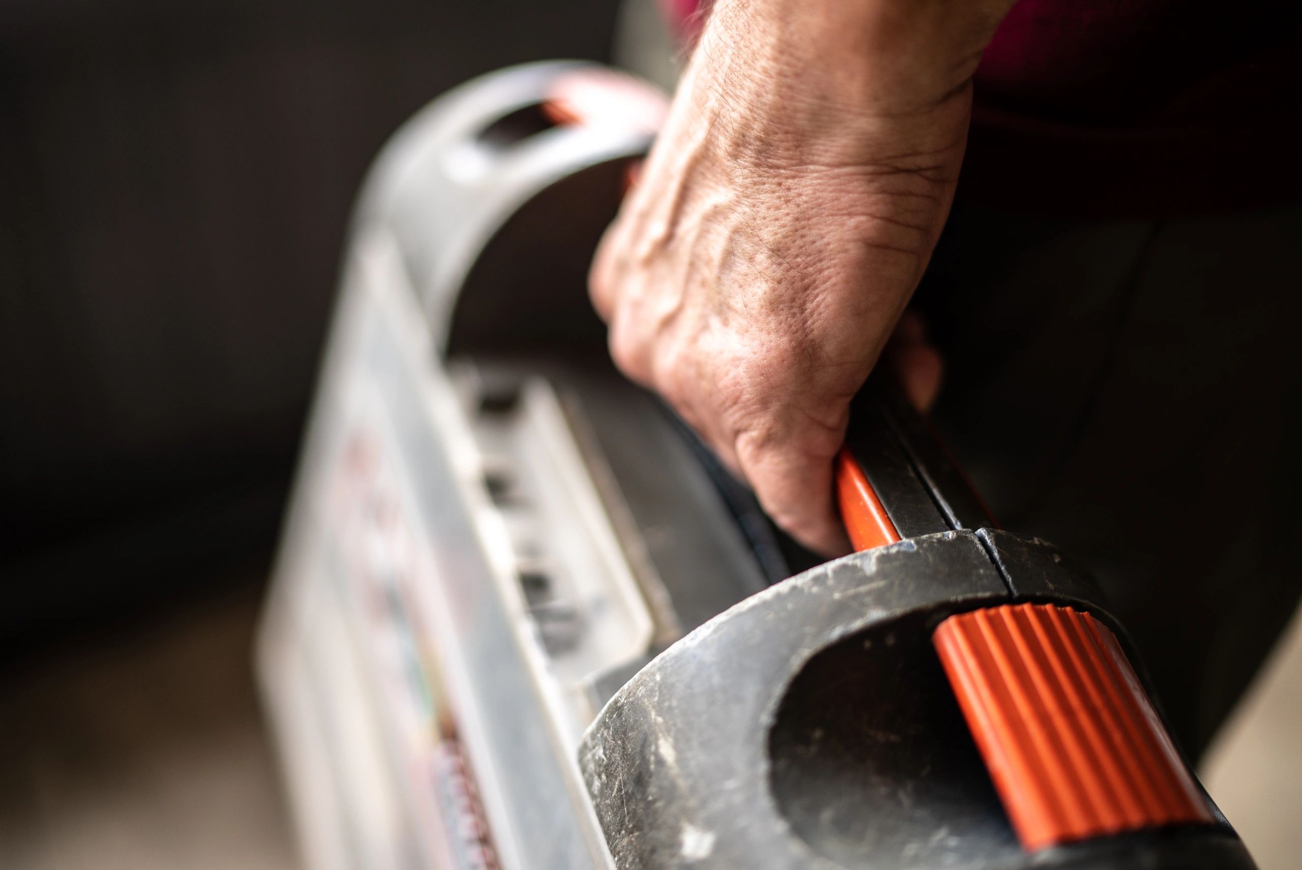 Tradesperson holding a toolbox for a service call